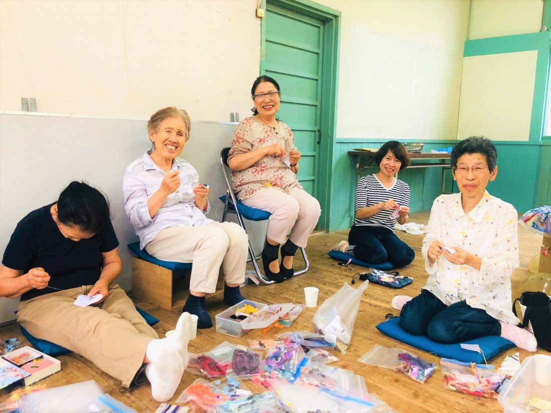 embroidering with island residents